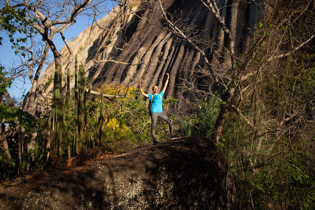 Emilly looking out at the landscape from a rock