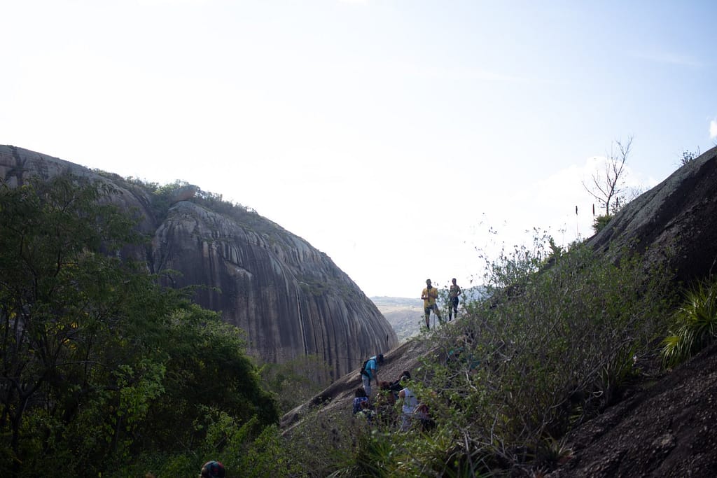 People climbing a rock in the interior of Paraíba